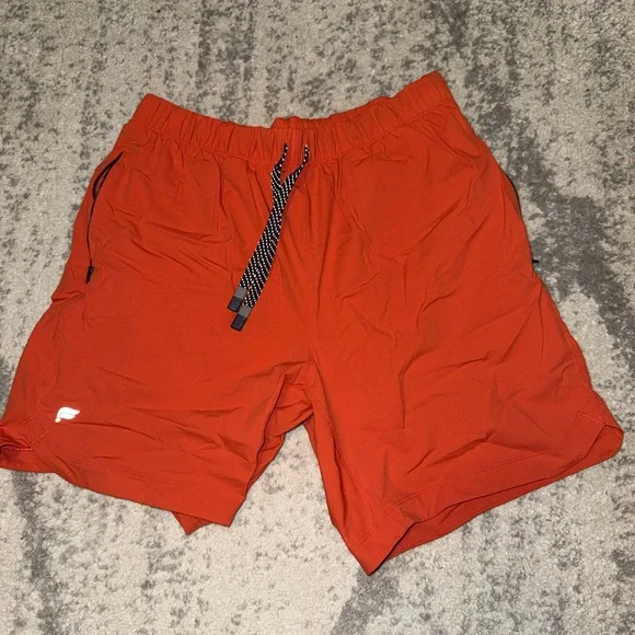 Men's Fabletics Orange Athletic Shorts Unlined - Picture 1 of 1